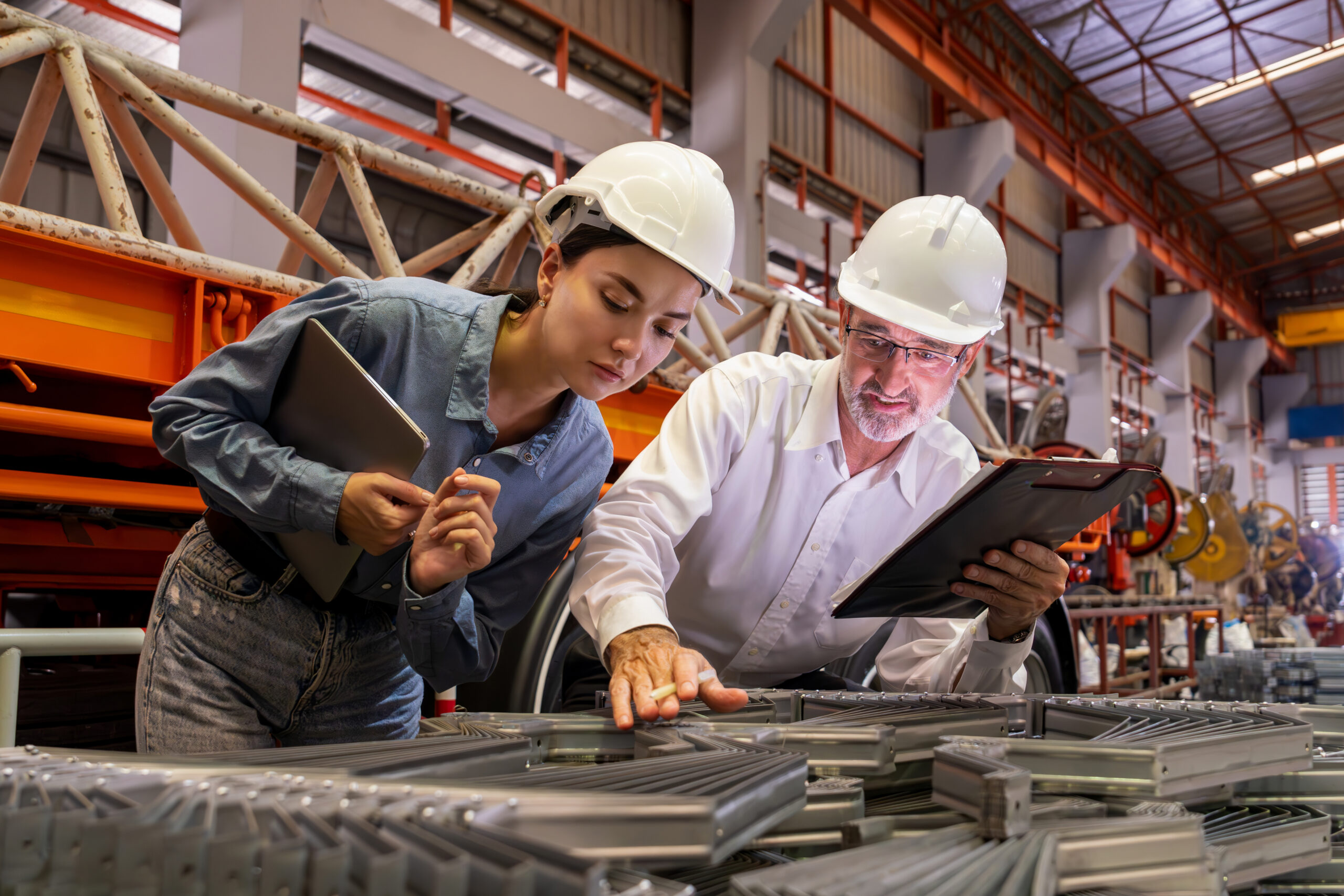 Metalwork manufacturing factory manager oversees highest quality of metal or steel frame for heavy construction. Steel manufacture inspection ensuring precision quality product. Exemplifying